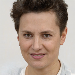 Joyful white adult female with short  brown hair and brown eyes