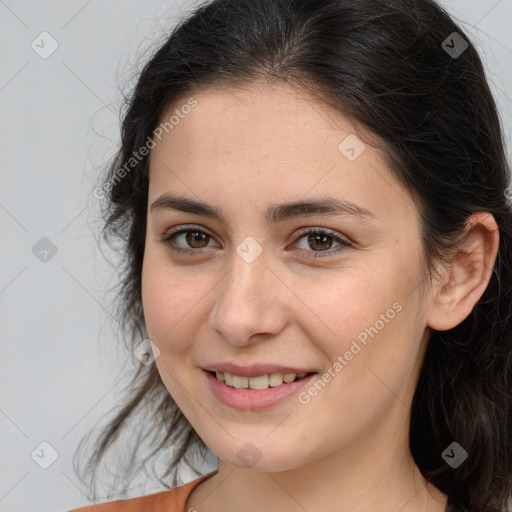 Joyful white young-adult female with long  brown hair and brown eyes