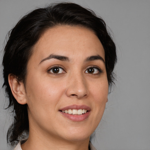 Joyful white young-adult female with medium  brown hair and brown eyes