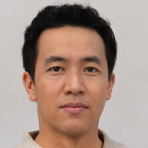 Neutral asian adult male with short  black hair and brown eyes