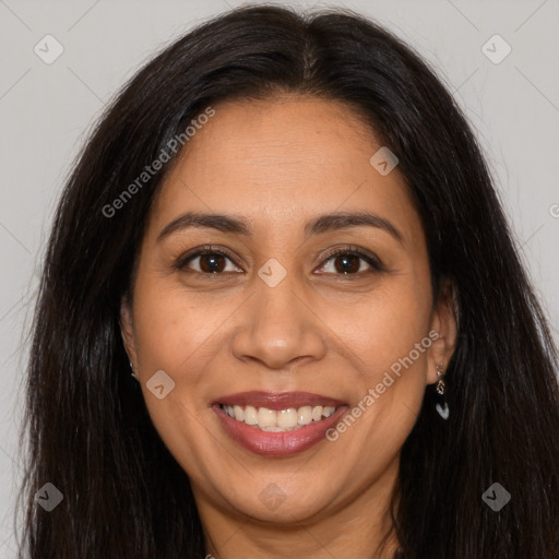 Joyful latino young-adult female with long  brown hair and brown eyes