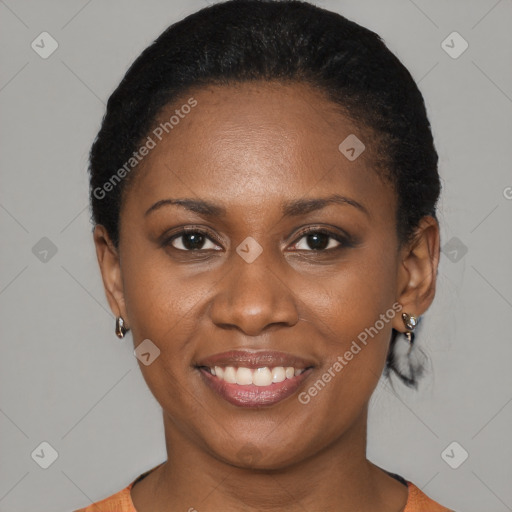 Joyful black young-adult female with short  black hair and brown eyes