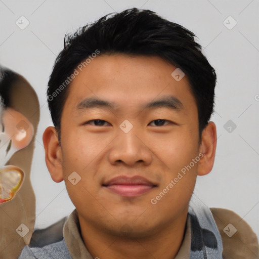 Joyful asian young-adult male with short  black hair and brown eyes