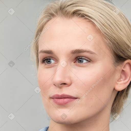 Joyful white young-adult female with medium  brown hair and blue eyes