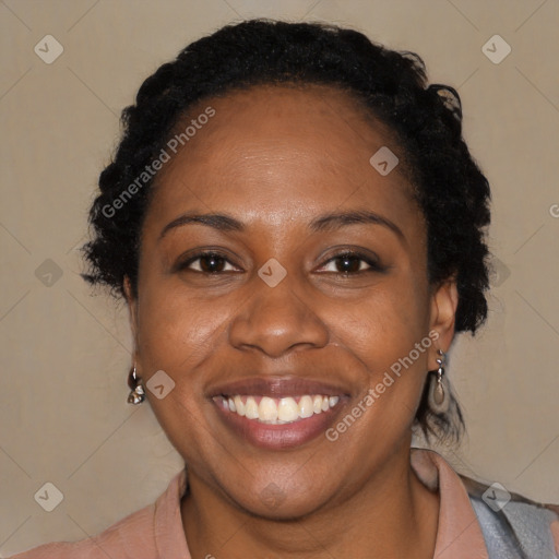 Joyful black adult female with short  black hair and brown eyes