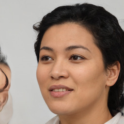 Joyful white young-adult female with medium  black hair and brown eyes