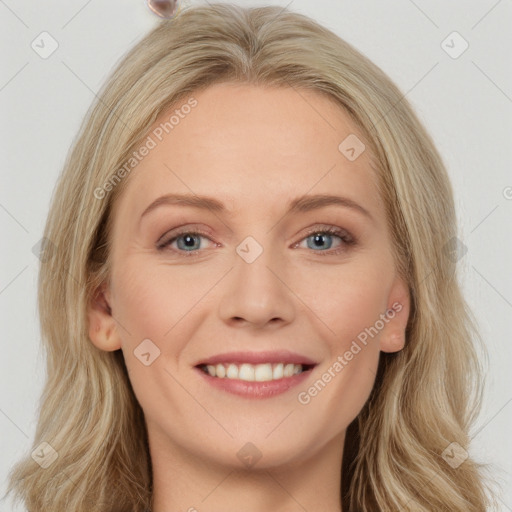 Joyful white young-adult female with long  brown hair and blue eyes