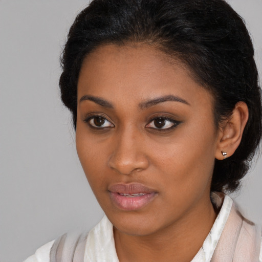 Neutral black young-adult female with medium  black hair and brown eyes