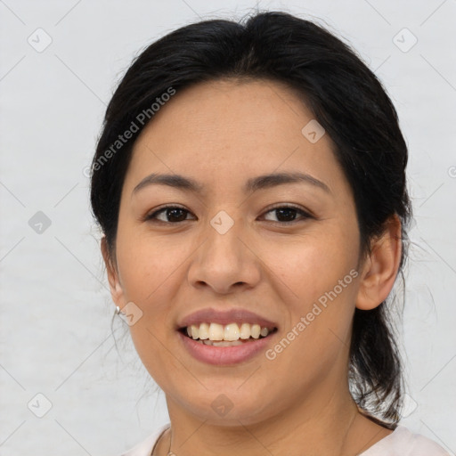 Joyful asian young-adult female with medium  brown hair and brown eyes