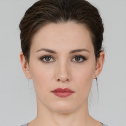 Neutral white young-adult female with short  brown hair and brown eyes