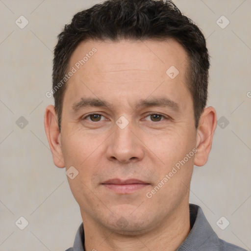 Joyful white adult male with short  brown hair and brown eyes