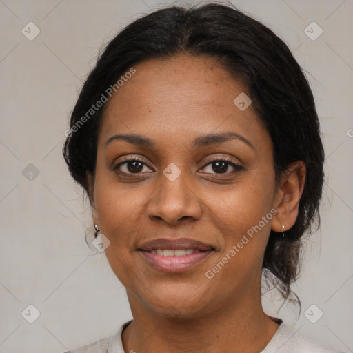 Joyful black young-adult female with medium  brown hair and brown eyes