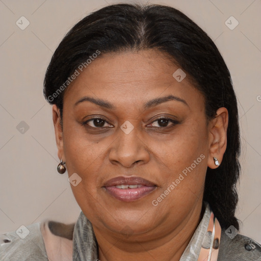 Joyful latino adult female with medium  brown hair and brown eyes