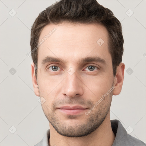 Neutral white young-adult male with short  brown hair and grey eyes