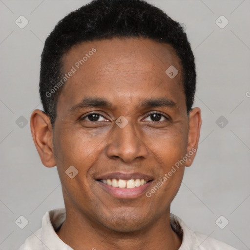 Joyful latino adult male with short  black hair and brown eyes