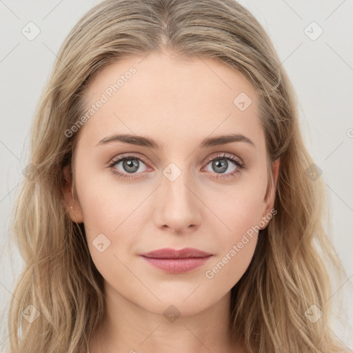 Joyful white young-adult female with long  brown hair and blue eyes