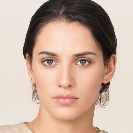 Neutral white young-adult female with medium  brown hair and brown eyes