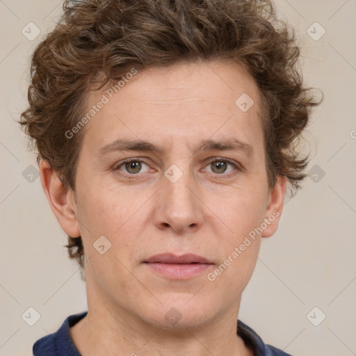 Joyful white adult male with short  brown hair and grey eyes