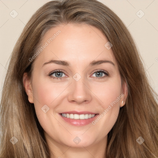 Joyful white young-adult female with long  brown hair and grey eyes