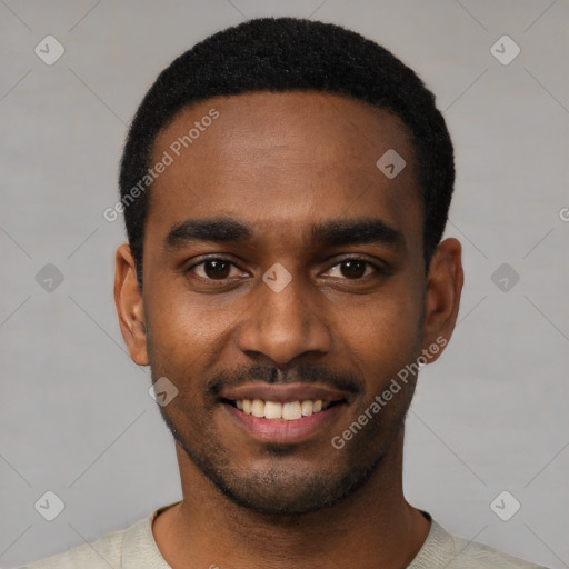 Joyful black young-adult male with short  black hair and brown eyes