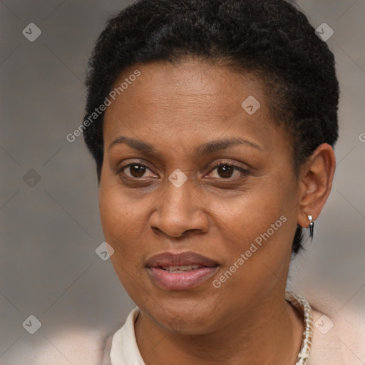 Joyful black adult female with short  brown hair and brown eyes