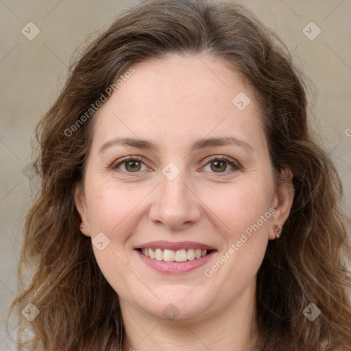 Joyful white young-adult female with long  brown hair and green eyes