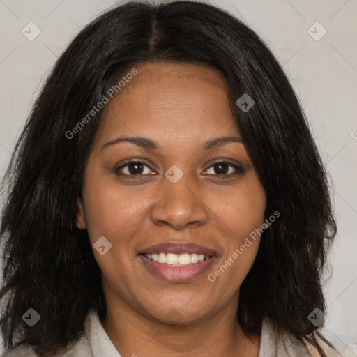 Joyful black adult female with medium  brown hair and brown eyes