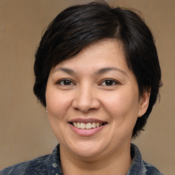 Joyful white adult female with medium  brown hair and brown eyes