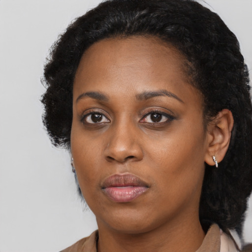 Neutral black young-adult female with medium  black hair and brown eyes