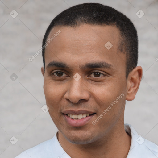 Joyful latino young-adult male with short  black hair and brown eyes