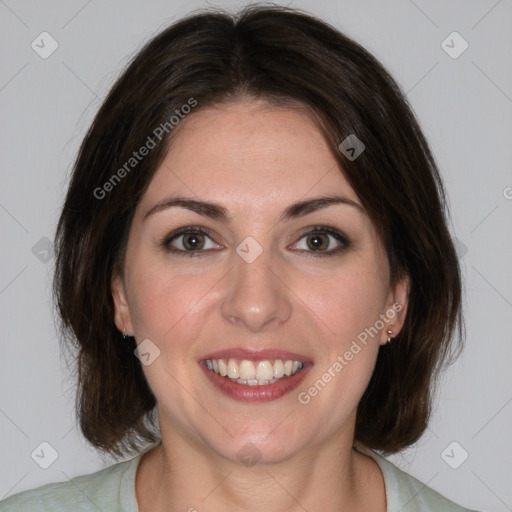 Joyful white young-adult female with medium  brown hair and green eyes