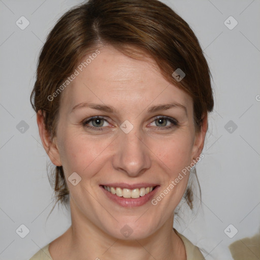 Joyful white adult female with medium  brown hair and blue eyes