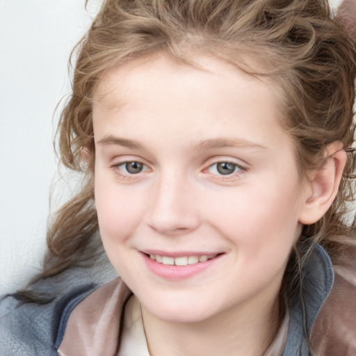 Joyful white child female with medium  brown hair and blue eyes