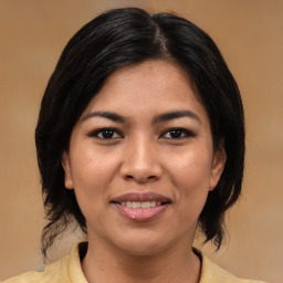 Joyful asian young-adult female with medium  brown hair and brown eyes