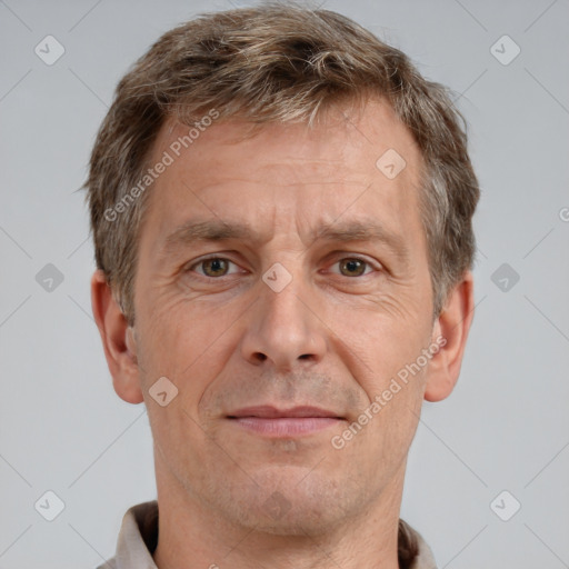 Joyful white adult male with short  brown hair and grey eyes