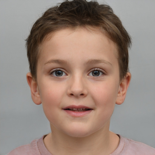 Joyful white child female with short  brown hair and brown eyes