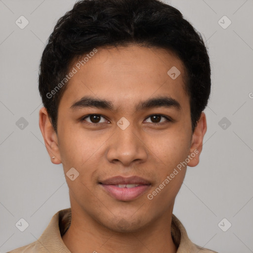 Joyful latino young-adult male with short  brown hair and brown eyes