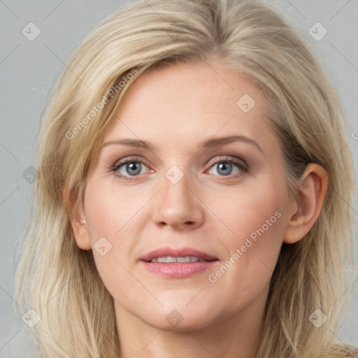 Joyful white young-adult female with medium  brown hair and blue eyes