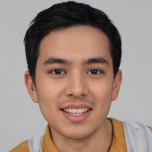 Joyful asian young-adult male with short  brown hair and brown eyes