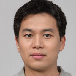 Neutral asian young-adult male with short  black hair and brown eyes