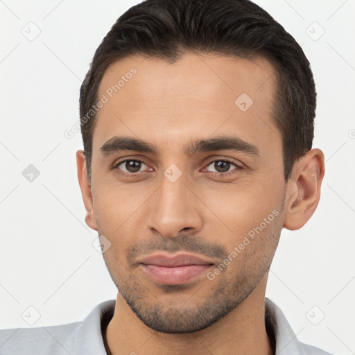 Joyful white young-adult male with short  brown hair and brown eyes