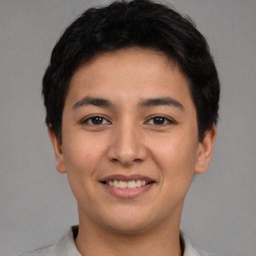 Joyful latino young-adult female with short  brown hair and brown eyes