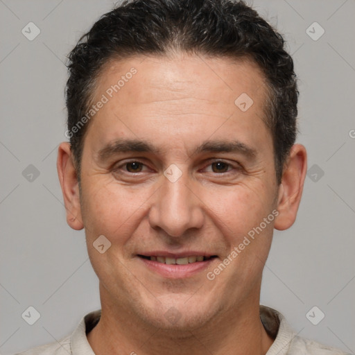 Joyful white adult male with short  brown hair and brown eyes