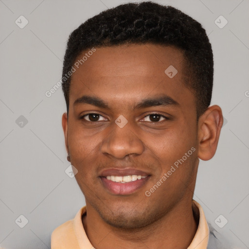 Joyful black young-adult male with short  brown hair and brown eyes