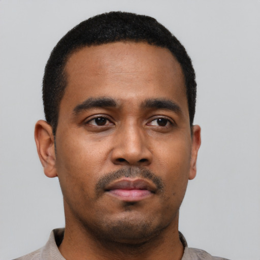 Neutral black young-adult male with short  black hair and brown eyes