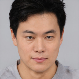 Neutral asian young-adult male with short  brown hair and brown eyes