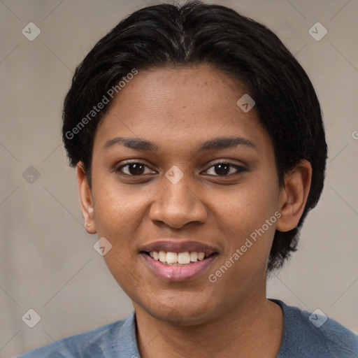 Joyful black young-adult female with short  black hair and brown eyes