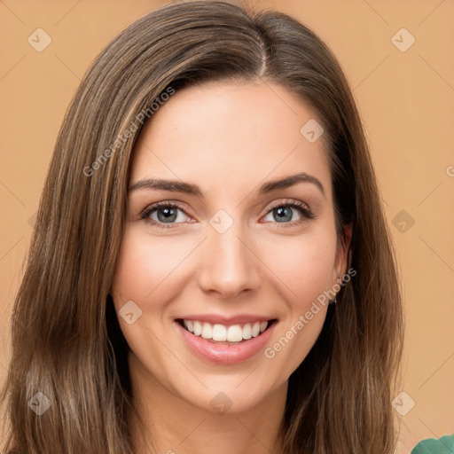 Joyful white young-adult female with long  brown hair and green eyes