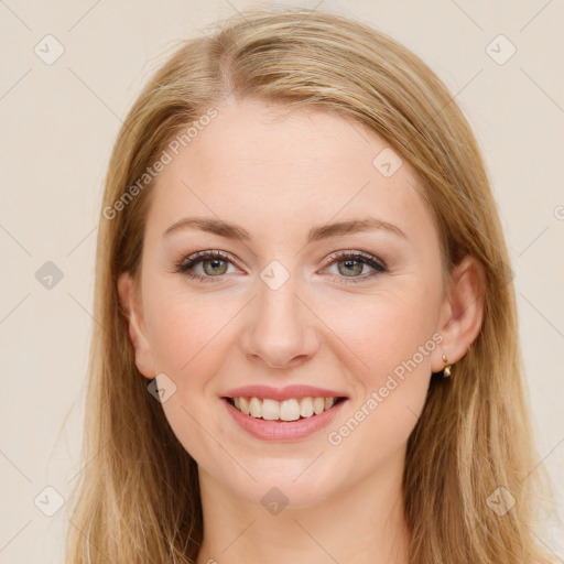 Joyful white young-adult female with long  brown hair and green eyes