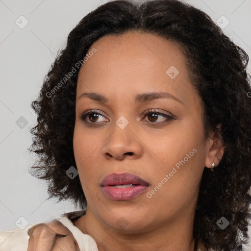 Joyful black young-adult female with medium  brown hair and brown eyes